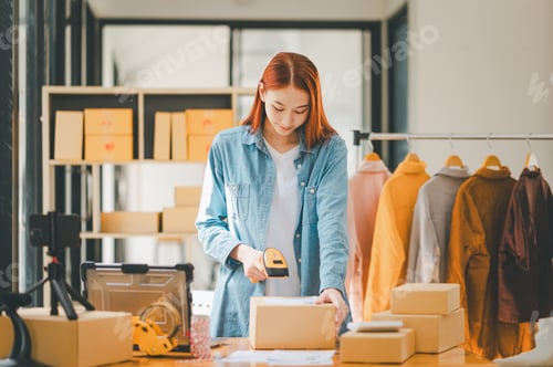 Preview: online small business owner scans a barcode-labeled parcel with a barcode scanner