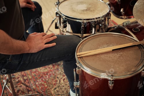 Preview: Drummer sitting at drums set