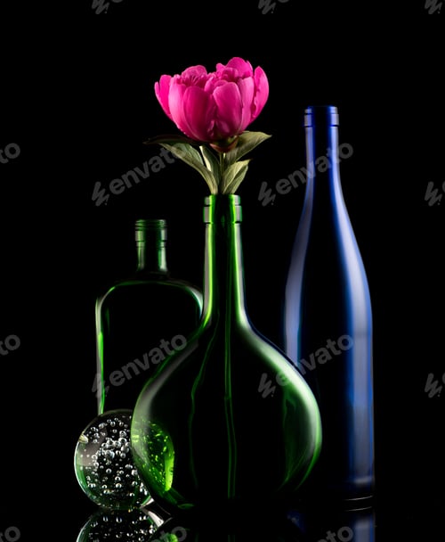 Preview: Still life glass bottles and flower