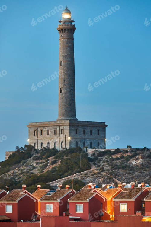 Preview: Cabo de Palos stone lighthouse at sunset. Mediterranean coastline, Spain