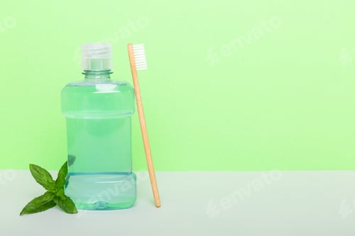 Preview: Mouthwash and fresh mint on colored background, top view with copy space for text