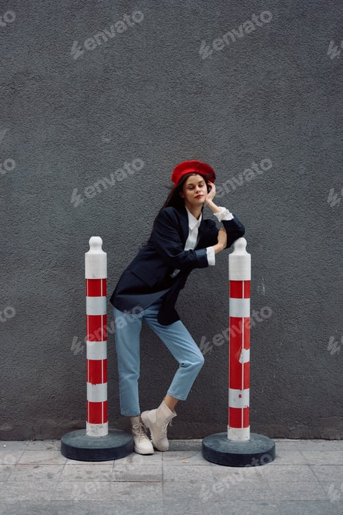 Preview: Fashion woman standing on the street in front of the city and road works tourist in stylish clothes