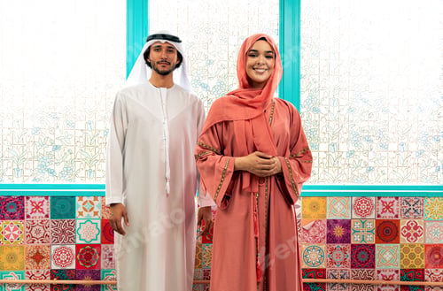 Preview: Young couple from Emirati spending time in a cafe