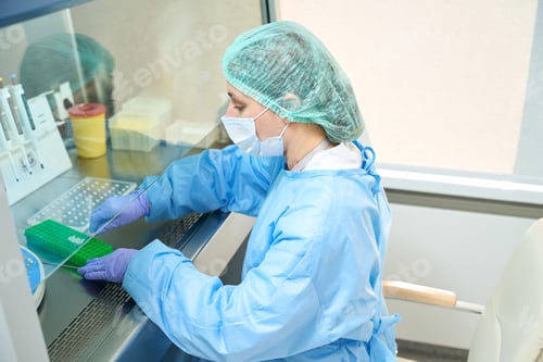 Preview: Laboratory employee works with virus samples in a sterile room