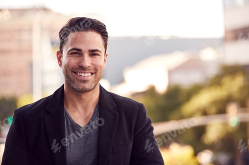 Preview: Portrait Of Smiling Businessman Standing Outside Office Building With City Skyline In Background