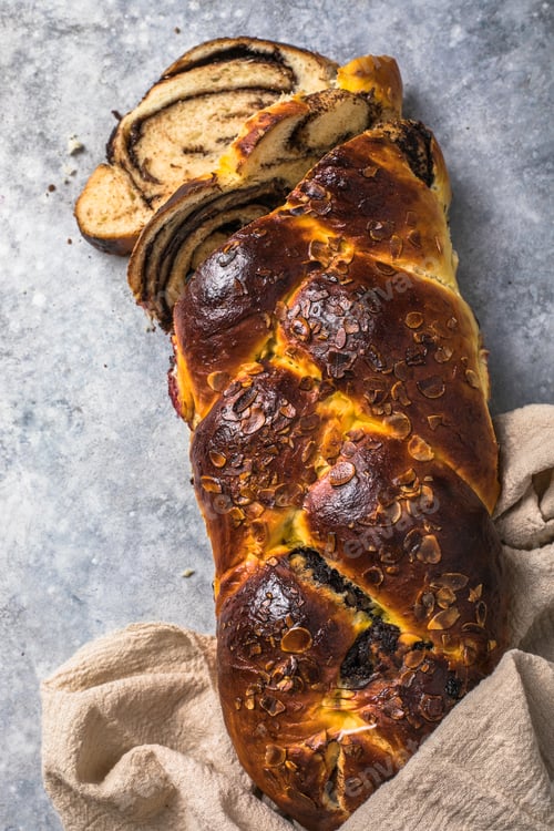 Preview: Traditional Greek Easter bread - tsoureki sliced Sweet marbled brioche plait with nuts and chocolate