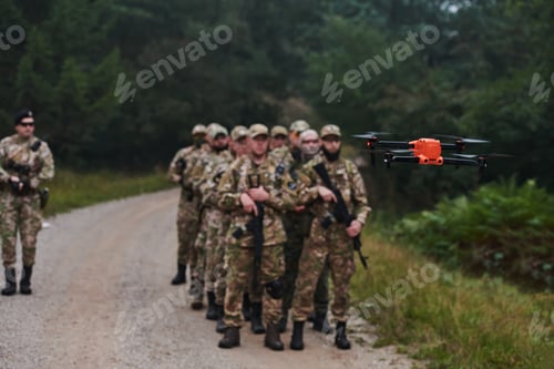 Preview: An elite military unit, led by a major, confidently parades through dense forest, showcasing