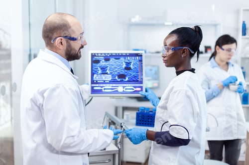 Preview: Group of diverse healthcare experts doing virus examining