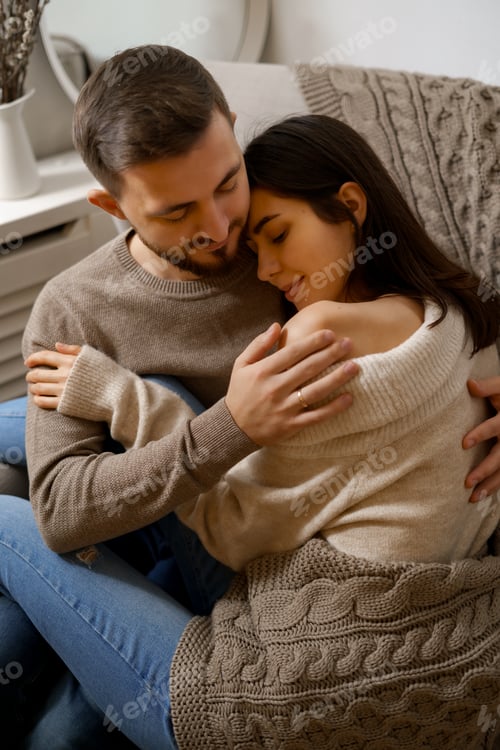 Preview: Romantic happy young couple enjoying holiday at home smiling