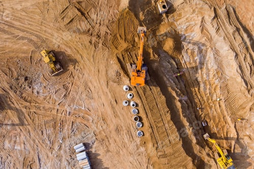 Preview: At a construction site, an excavator digs a trench in order to lay sewer lines and connect