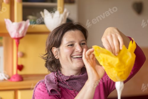 Preview: Woman making paper lamp at home