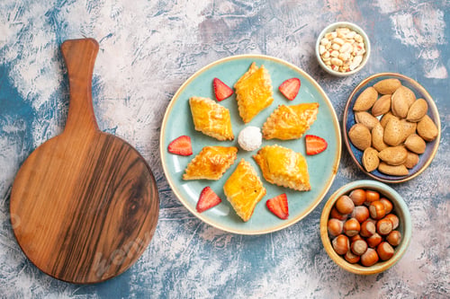 Preview: top view yummy sweet cakes with nuts on blue background fruit sweet cake biscuit