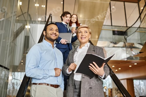Preview: Unified Ascent: Diverse Business Team Before Escalator