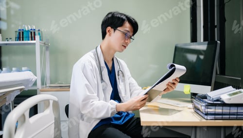 Preview: Doctor analyzing patient data on tablet in clinical lab. Medical professional in hospital with