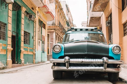 Preview: View of yellow classic vintage car in Old Havana, Cuba
