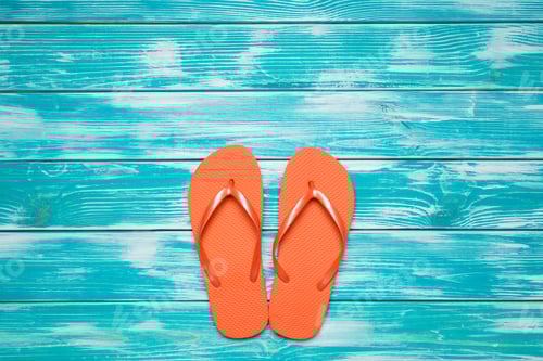 Preview: Vibrant Orange Flip Flops on Blue Wood Planks