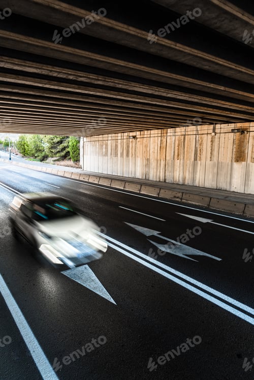 Preview: Car with sweeping contrails traveling at high speed through the interior of a tunnel.