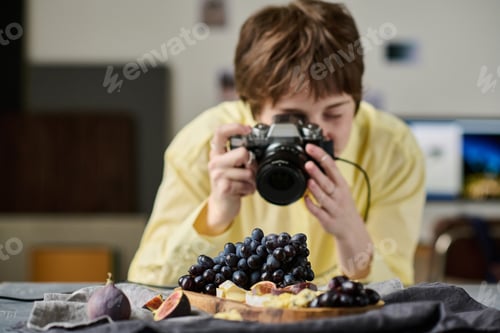 Preview: Woman taking photo with mobile phone