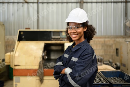 Preview: Smiling portrait of confident engineer worker at factory