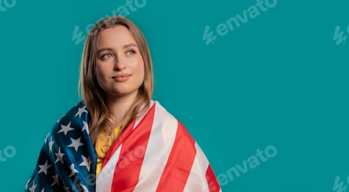 Preview: Proud woman with national USA flag on blue background.American patriot,US banner