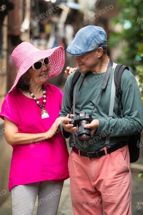 Preview: A happy senior couple strolling along a city's old neighborhood, enjoying travel