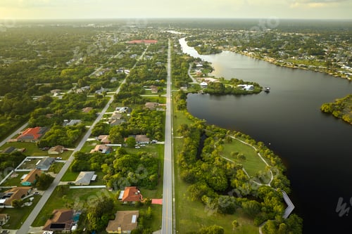 Preview: Aerial view of rural private houses in remote suburbs located near Florida wildlife wetlands