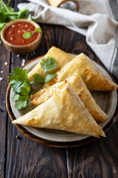 Preview: Asian food. Vegetarian samsa (samosas) with tomato sauce.