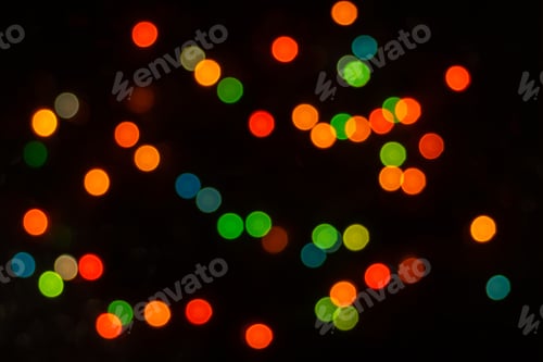 Preview: Perfect bokeh for festive New Year and Christmas background. Defocused yellow, green light circles.
