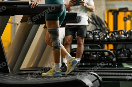 Preview: Young Adult Caucasian Woman Walking on Treadmill during Physical Rehabilitation