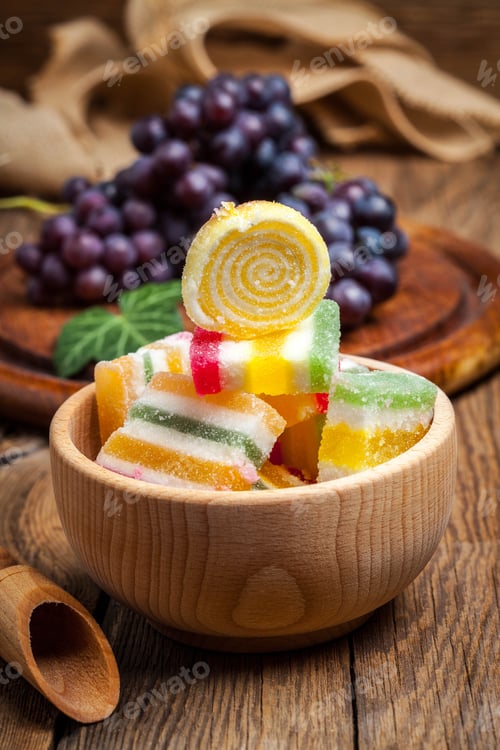 Preview: Colorful jelly candies in wooden bowl.