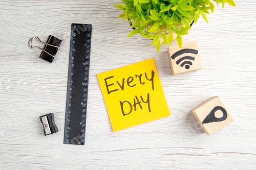 Preview: top view every day note with little green plant on white background work color business job