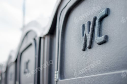 Preview: Street portable toilets in a row. Selective focus.