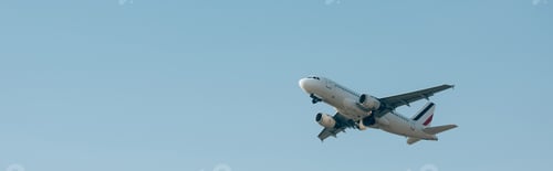 Preview: Flight departure of airplane in blue sky with copy space, panoramic shot