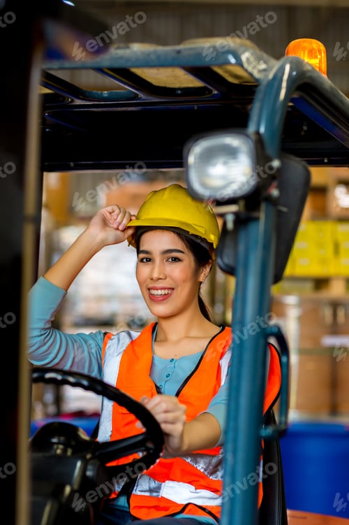 Preview: women worker at forklift driver happy working in industry factory logistic ship.