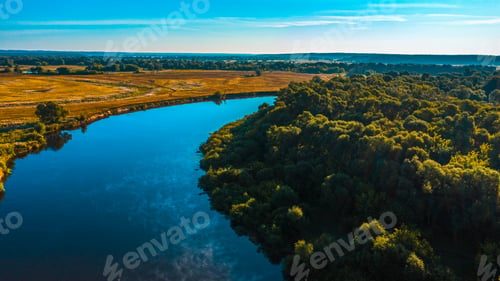 Preview: Aerial view of a beautiful summer landscape over river while dawn.
