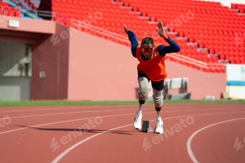 Preview: Asian para-athletes with prosthetic blades sprint on a running track at stadium.