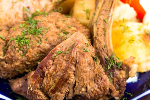 Preview: Delicious baked meat mix with garnish.