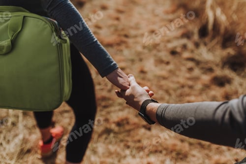 Preview: Couple Holding Hands On a Sunny Day