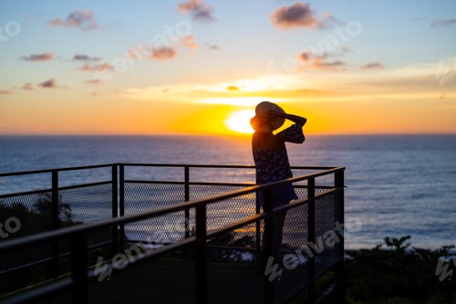 Preview: Woman look at the sunset in balcony