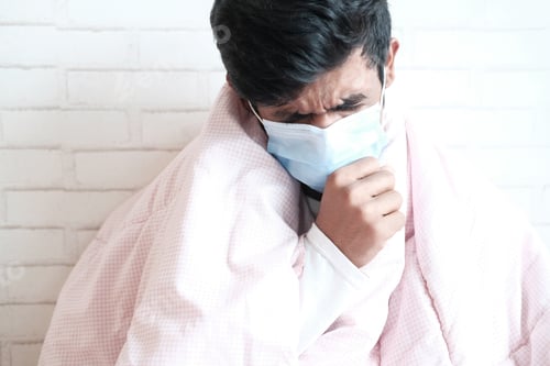 Preview: young sick man coughing and sneezes