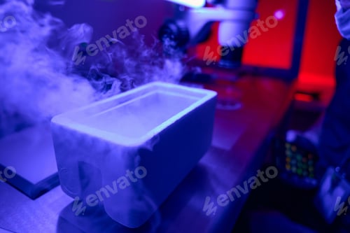 Preview: Cold smoke from liquid nitrogen rising above cuvette