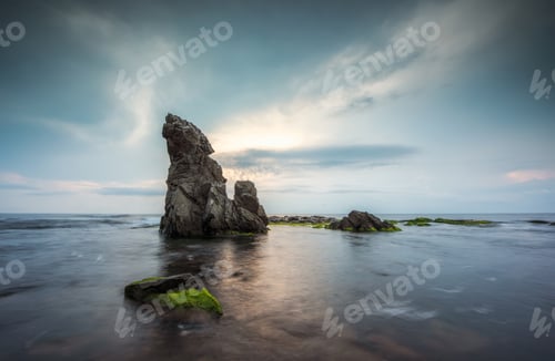 Preview: Sea sunrise at rocky beach
