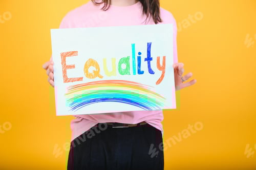 Preview: Hands of gay man holding lgbt banner on rainbow flag background lgbt symbol
