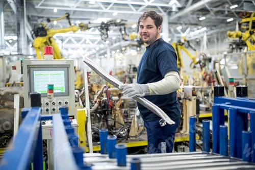 Preview: Portrait of confident man working in a modern factory
