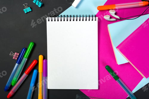 Preview: Colorful stationery and blank notebook on a creative workspace with vibrant papers