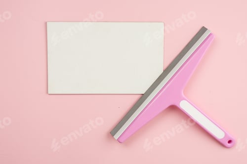 Preview: Window brush lying on empty white mockup on pink background. Concept cleaning service