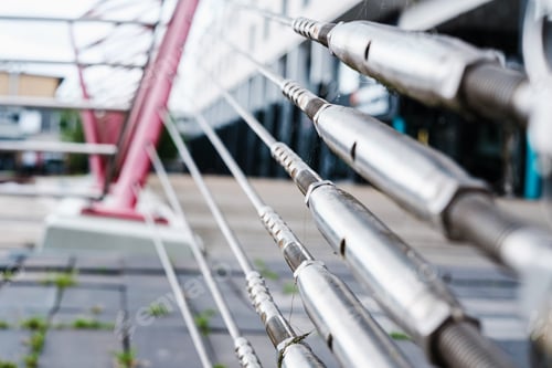 Preview: Steel stays attached to a support driven into the ground hold the steel cables of a bridge.