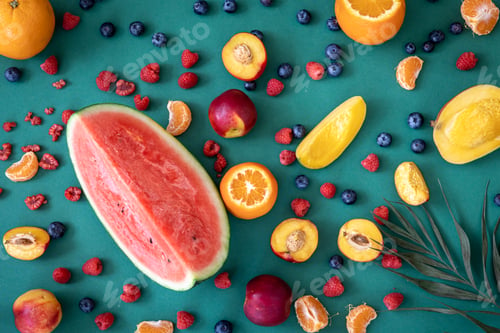 Preview: Tropical fruits on a blue background, flat lay.