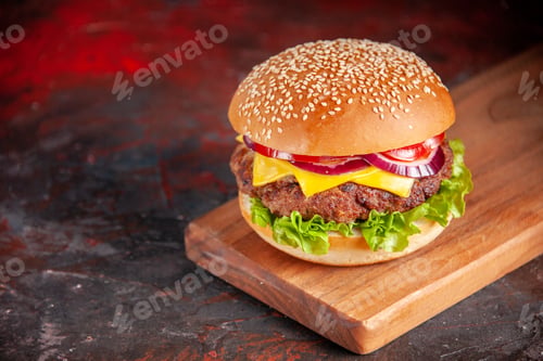 Preview: front view delicious cheeseburger with meat tomatoes and green salad on dark background sandwich