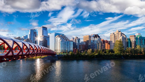 Preview: Peace Bridge across Bow River during a vibrant summer sunrise